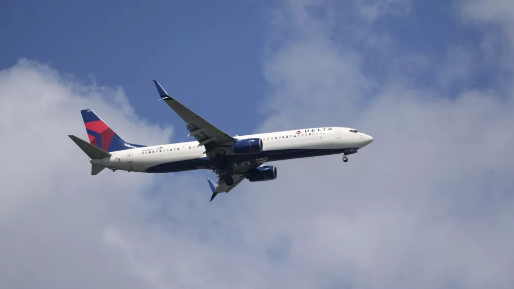 FILE - A Delta Airlines plane lands at Sarasota-Bradenton International Airport Friday, March 28, 2025. (AP Photo/Gene J. Puskar, File)