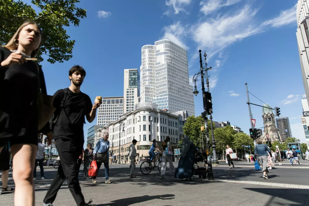 July 3, 2025, Berlin, Berlin, Germany: Pedestrians crossed sunlit streets and browsed storefronts in Berlin&acirc;&euro;s Charlottenburg district on July 3, 2025, as Germany faces ongoing economic headwinds. The scenes of daily life come amid broader concerns over the country&acirc;&euro;s labor market. Official figures this week showed unemployment stubbornly high, with industrial job losses mounting despite a booming defense sector fueled by European rearmament. More than 100,000 jobs have disappeared from the metal and electronics industries in the past year alone, contributing to fears of long-term deindustrialization in Europe&acirc;&euro;s largest economy. The Charlottenburg district, a bustling west Berlin neighborhood known for its retail streets and caf&Atilde;s, reflects both resilience and uncertainty. Tourists and Berliners alike filled sidewalks, offering a snapshot of urban life against the backdrop of shifting economic tides. German leaders have warned of tough months ahead as energy prices, global competition, and structural challenges weigh on traditional industries.,Image: 1018116254, License: Rights-managed, Restrictions:, Model Release: no
