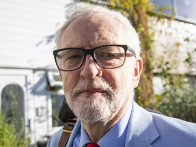 Britain's former opposition Labour Party leader Jeremy Corbyn leaves his home in London, Wednesday Nov. 18, 2020. Corbyn will be reinstated into the political party it is announced Wednesday after a three-week suspension as Labour&acirc;&euro;&trade;s National Executive Committee seeks to draw a line under years of tumultuous divisions over alleged anti-Jewish prejudice in the party. (Aaron Chown/PA via AP)