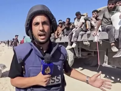 This undated recent image, taken from video broadcast by the Qatari-based television station Al Jazeera, shows the network's Arabic-language Gaza correspondent, Anas al-Sharif, reporting on camera in Gaza. Al-Sharif and four other Al Jazeera staff members were killed by an Israeli drone strike on their tent in Gaza City shortly before midnight on Sunday. (Al Jazeera via AP)