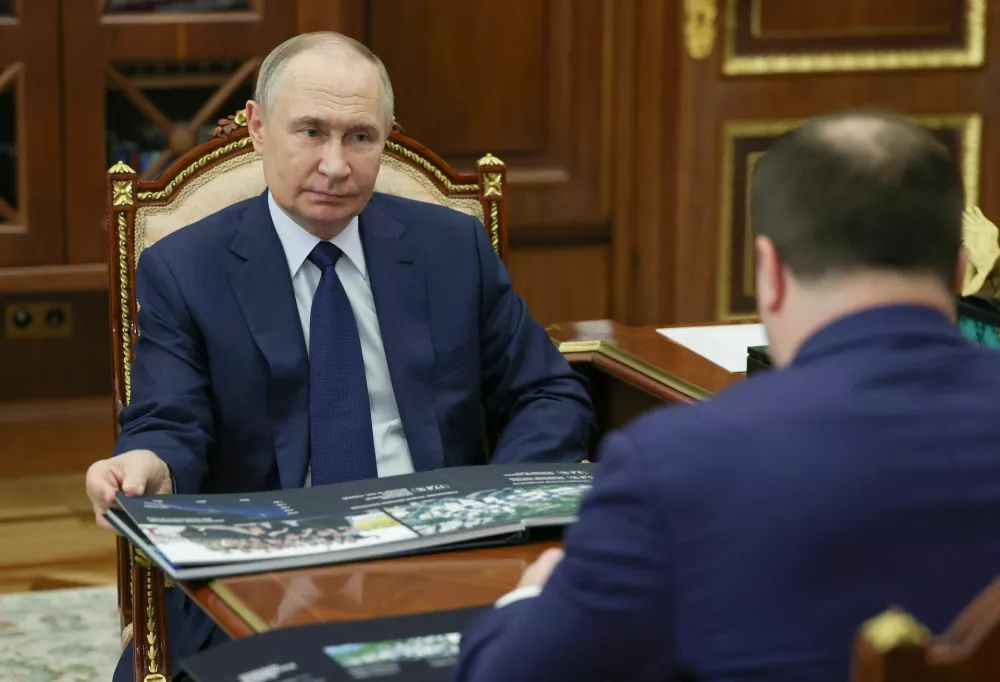 Russia's President Vladimir Putin attends a meeting with Governor of the Omsk region Vitaly Khotsenko in Moscow, Russia, August 11, 2025. Sputnik/Vyacheslav Prokofyev/Pool via REUTERS ATTENTION EDITORS - THIS IMAGE WAS PROVIDED BY A THIRD PARTY.