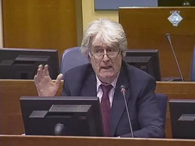 A video grab shows wartime Bosnian Serb leader Radovan Karadzic as he takes the stand at his war crimes trial at The Hague March 1, 2010. Karadzic, who rejects responsibility for some of Europe's worst atrocities since World War Two, denies the 11 charges against him, including two of genocide, for his actions during the Bosnian War of 1992-95, which pitted Serbs against Muslims and Croats.  REUTERS/ICTY via Reuters TV (NETHERLANDS - Tags: CIVIL UNREST POLITICS CRIME LAW) FOR EDITORIAL USE ONLY. NOT FOR SALE FOR MARKETING OR ADVERTISING CAMPAIGNS