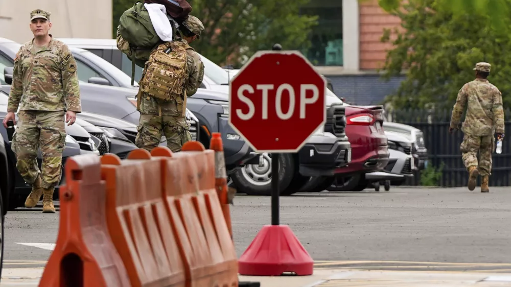 National Guard troops arrive at the District of Columbia National Guard Headquarters, Tuesday, Aug. 12, 2025, in Washington. (AP Photo/Julia Demaree Nikhinson)