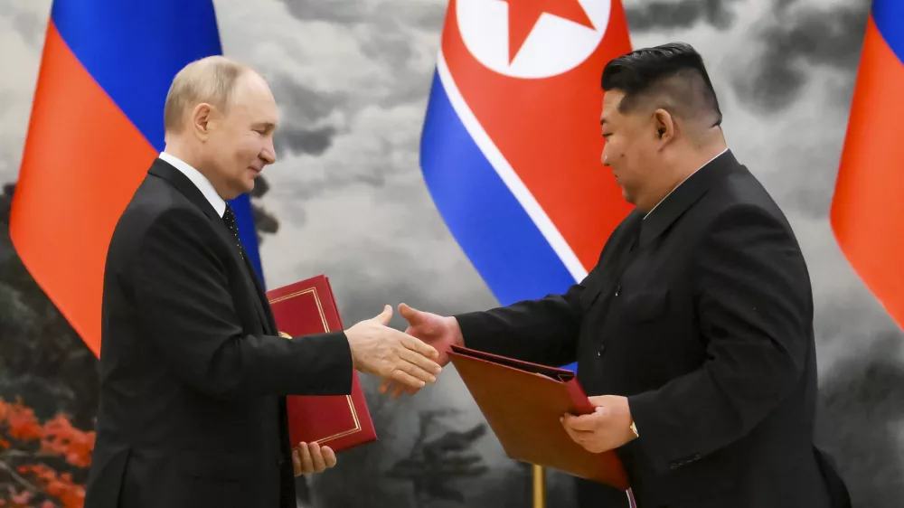 FILE - Russian President Vladimir Putin, left, and North Korea's leader Kim Jong Un exchange documents during a signing ceremony of the new partnership in Pyongyang, North Korea, on June 19, 2024. (Kristina Kormilitsyna, Sputnik, Kremlin Pool Photo via AP, File)