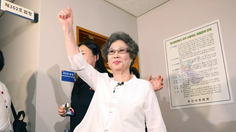 Choi Mal-ja (C), who was convicted 61 years ago for biting off the tongue of her attempted rapist, reacts after her retrial hearing at the Busan District Court in Busan on July 23, 2025. A South Korean court reopened a decades-old case on July 23, after the country's #MeToo movement inspired a woman to challenge her conviction for defending herself against sexual violence 61 years ago.,Image: 1024835661, License: Rights-managed, Restrictions: - South Korea OUT / NO ARCHIVES - RESTRICTED TO SUBSCRIPTION USE, Model Release: no