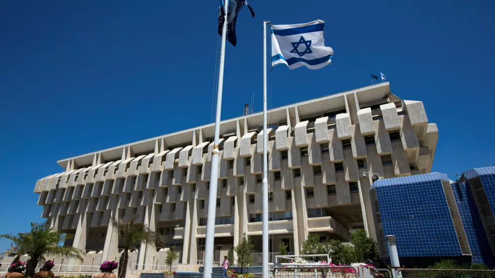 FILE PHOTO - An Israeli flag flutters outside the Bank of Israel building in Jerusalem August 7, 2013.  REUTERS/Ronen Zvulun/File Photo          GLOBAL BUSINESS WEEK AHEAD PACKAGE - SEARCH BUSINESS WEEK AHEAD 23 JANUARY FOR ALL IMAGES
