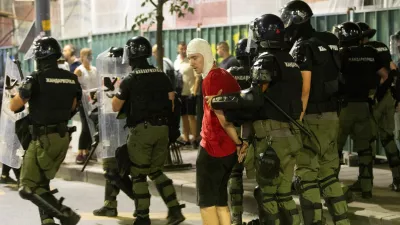 Serbian police detain a demonstrator during standoff between ruling party supporters and anti-government protesters in Belgrade, Serbia, August 13, 2025. REUTERS/Djordje Kojadinovic