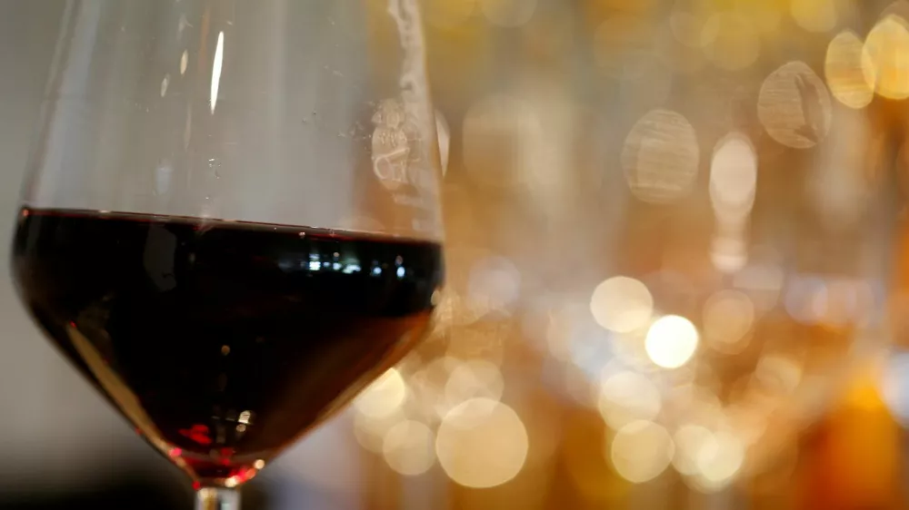 FILE PHOTO: A glass of French red wine is displayed at the Chateau du Pavillon in Sainte-Croix-Du-Mont, France, July 29, 2019. REUTERS/Regis Duvignau/File Photo
