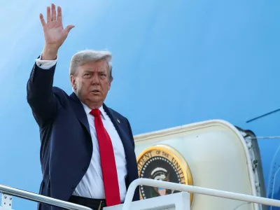 U.S. President Donald Trump waves while boarding Air Force One, as he departs for Alaska to meet with Russian President Vladimir Putin to negotiate for an end to the war in Ukraine, from Joint Base Andrews in Maryland, U.S., August 15, 2025. REUTERS/Kevin Lamarque