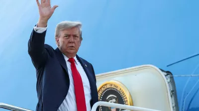 U.S. President Donald Trump waves while boarding Air Force One, as he departs for Alaska to meet with Russian President Vladimir Putin to negotiate for an end to the war in Ukraine, from Joint Base Andrews in Maryland, U.S., August 15, 2025. REUTERS/Kevin Lamarque