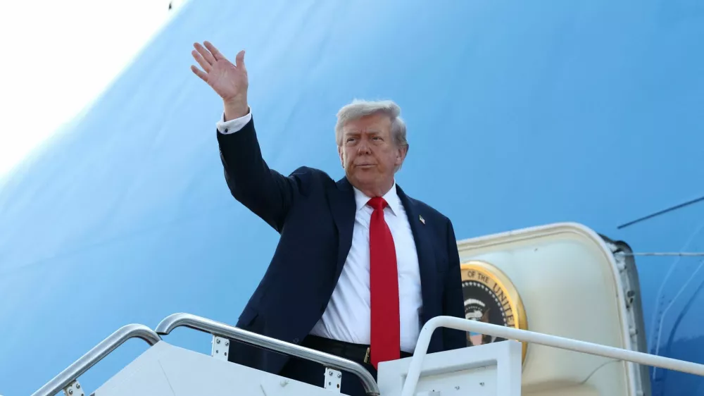 U.S. President Donald Trump boards Air Force One as he departs for Alaska to meet with Russian President Vladimir Putin to negotiate for an end to the war in Ukraine, from Joint Base Andrews in Maryland, U.S., August 15, 2025. REUTERS/Kevin Lamarque