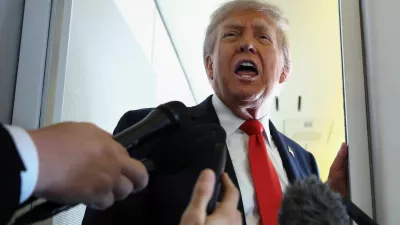 U.S. President Donald Trump speaks to reporters aboard Air Force One on his way to Alaska meet with Russian President Vladimir Putin on to negotiate an end to the war in Ukraine, U.S., August 15,2025. REUTERS/Kevin Lamarque