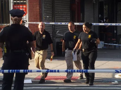 17 August 2025, US, BrooklynNew York City Police Department officers investigate the shooting scene at the 'Taste of the City' Lounge after multiple shooters open fire, leaving three dead and eight injuered. PhotoBruce Cotler/ZUMA Press Wire/dpa
