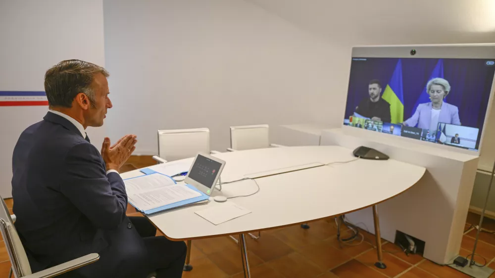 French President Emmanuel Macron attends a video conference with European Commission Ursula van der Leyen and Ukraine's President Volodymyr Zelenskyy as part of the so-called "coalition of the willing"Sunday, Aug. 17, 2025 at the Fort de Bregancon in Bormes-les-Mimosas, southern France. (AP Photo/Philippe Magoni, Pool)