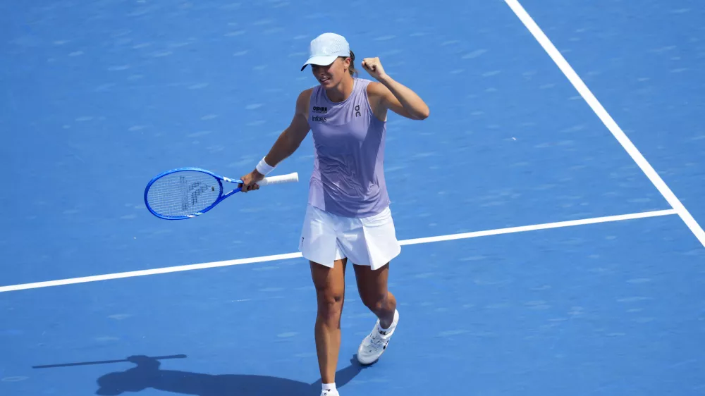 Aug 17, 2025; Cincinnati, OH, USA; Iga Swiatek (POL) reacts to defeating Elena Rybakina (KAZ) during the Cincinnati Open at the Lindner Family Tennis Center. Mandatory Credit: Aaron Doster-Imagn Images