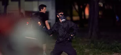August 16, 2025, Belgrade, Vojvodina province, Serbia: Demonstrators clashed with riot police in Belgrade as tear gas was used during days of anti-government protests. A protester throws a firecracker at a police cordon. (Credit Image: ? Marko Dimic/ZUMA Press Wire)