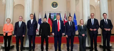 U.S. President Donald Trump, Ukrainian President Volodymyr Zelenskiy, German Chancellor Friedrich Merz, French President Emmanuel Macron, British Prime Minister Keir Starmer, Italian Prime Minister Giorgia Meloni, and Finland's President Alexander Stubb, NATO Secretary General Mark Rutte and European Commission President Ursula von der Leyen pose for a family photo amid negotiations to end the Russian war in Ukraine, at the White House in Washington, D.C., U.S., August 18, 2025. REUTERS/Alexander Drago   TPX IMAGES OF THE DAY