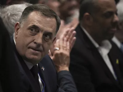 Bosnian Serb President Milorad Dodik, left, attends the International Conference on Combating Antisemitism, in Jerusalem, Thursday, March 27, 2025. (AP Photo/Leo Correa)