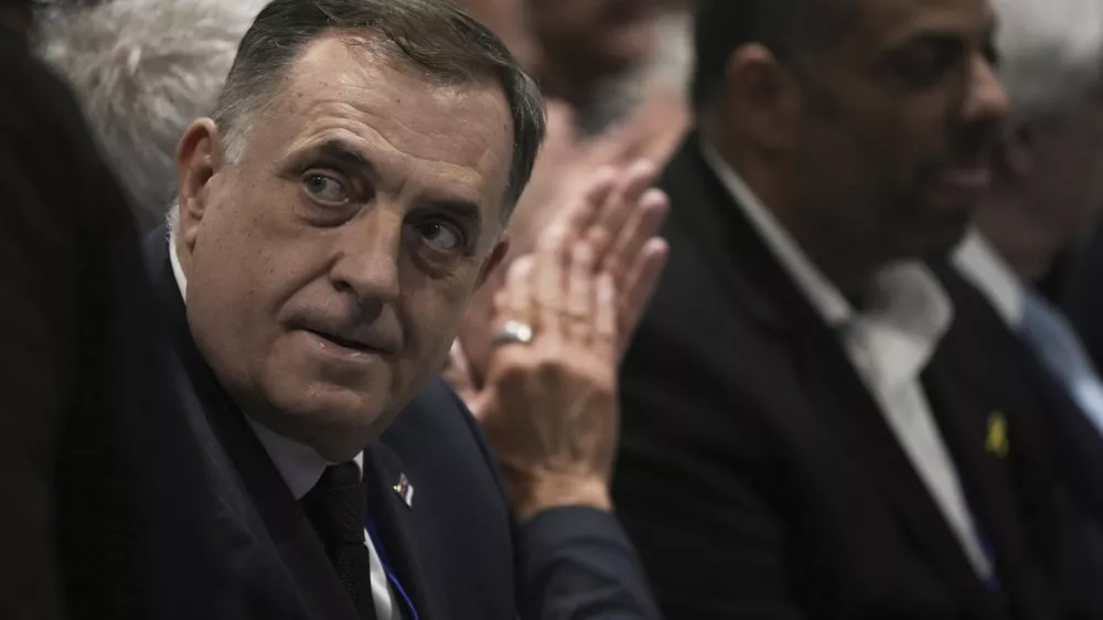 Bosnian Serb President Milorad Dodik, left, attends the International Conference on Combating Antisemitism, in Jerusalem, Thursday, March 27, 2025. (AP Photo/Leo Correa)