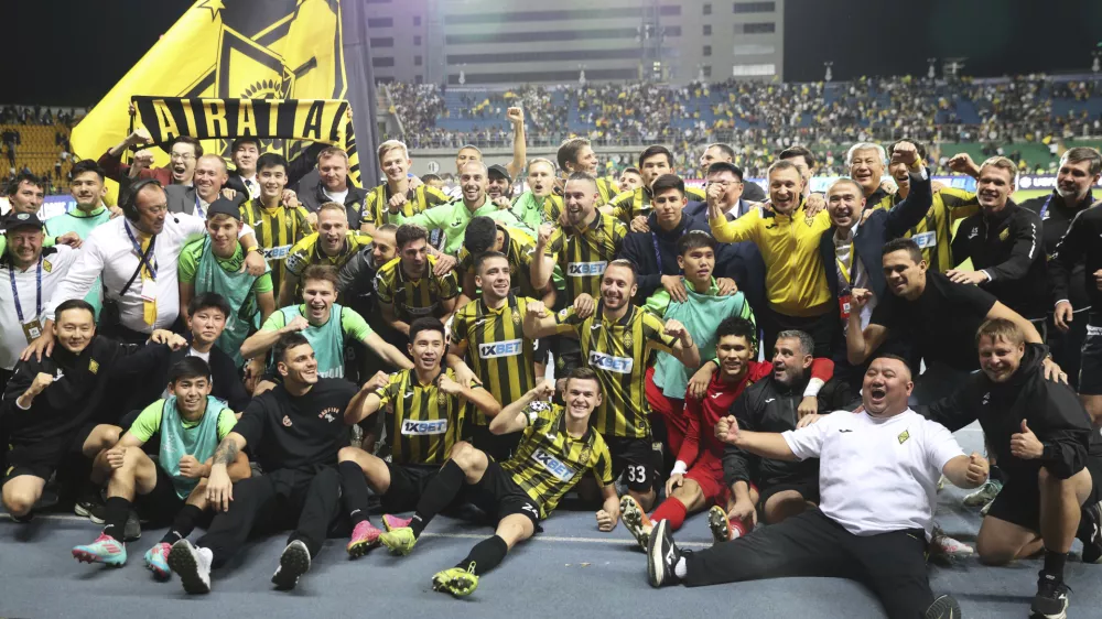 Kairat players celebrate after winning the Champions League playoff second leg soccer match between Kairat and Celtic at Ortalyk stadium in Almaty, Kazakhstan, Wednesday, Aug. 27, 2025. (AP Photo/Alikhan Sariyev)