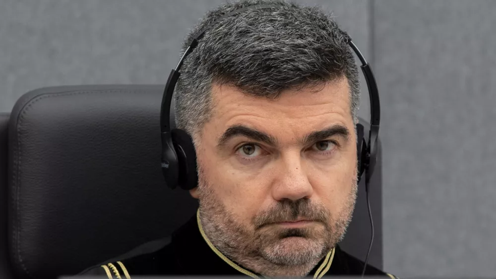 Judge Nicolas Guillou opens the court session for Veseli's initial appearance at the Kosovo Specialist Chambers in The Hague, Netherlands November 10, 2020. Peter Dejong/Pool via REUTERS