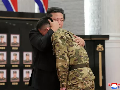 North Korean leader Kim Jong hugs a soldier as he attends a national commendation ceremony for the commanders and fighters of the Korean People's Army's overseas operations unit, at the headquarters of the Central Committee of the Korean Workers' Party, in Pyongyang, North Korea, in this photo released on August 22, 2025 by North Korea's Korean Central News Agency (KCNA).&nbsp;KCNA&nbsp;via REUTERS ATTENTION EDITORS - THIS IMAGE WAS PROVIDED BY A THIRD PARTY. REUTERS IS UNABLE TO INDEPENDENTLY VERIFY THIS IMAGE. NO THIRD PARTY SALES. SOUTH KOREA OUT. NO COMMERCIAL OR EDITORIAL SALES IN SOUTH KOREA.