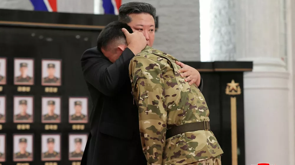 North Korean leader Kim Jong hugs a soldier as he attends a national commendation ceremony for the commanders and fighters of the Korean People's Army's overseas operations unit, at the headquarters of the Central Committee of the Korean Workers' Party, in Pyongyang, North Korea, in this photo released on August 22, 2025 by North Korea's Korean Central News Agency (KCNA).&nbsp;KCNA&nbsp;via REUTERS ATTENTION EDITORS - THIS IMAGE WAS PROVIDED BY A THIRD PARTY. REUTERS IS UNABLE TO INDEPENDENTLY VERIFY THIS IMAGE. NO THIRD PARTY SALES. SOUTH KOREA OUT. NO COMMERCIAL OR EDITORIAL SALES IN SOUTH KOREA.