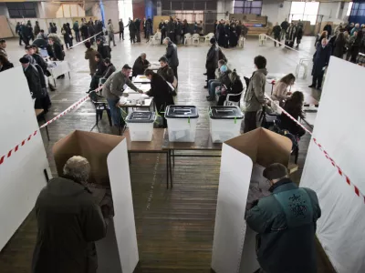 Voters cast their ballots at a polling station in Pristina, Kosovo, Saturday, Nov. 17, 2007. Kosovo's voters were choosing a new parliament Saturday they hope will deliver independence from Serbia.(AP Photo/Darko Bandic)