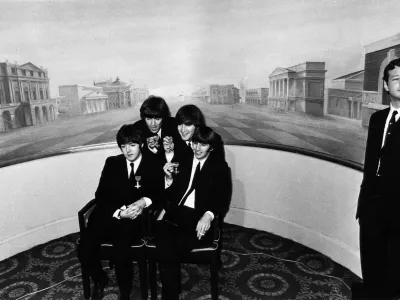 UNITED KINGDOM - OCTOBER 26: Photo of BEATLES and Brian EPSTEIN; L-R. Paul McCartney, George Harrison, John Lennon, George Harrison, Brian Epstein, receiving MBE's at Buckingham Palace (Photo by Cummings Archives/Redferns)