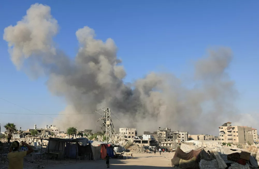 Smoke rises following an explosion during an Israeli operation, in Gaza City, August 26, 2025. REUTERS/Dawoud Abu Alkas