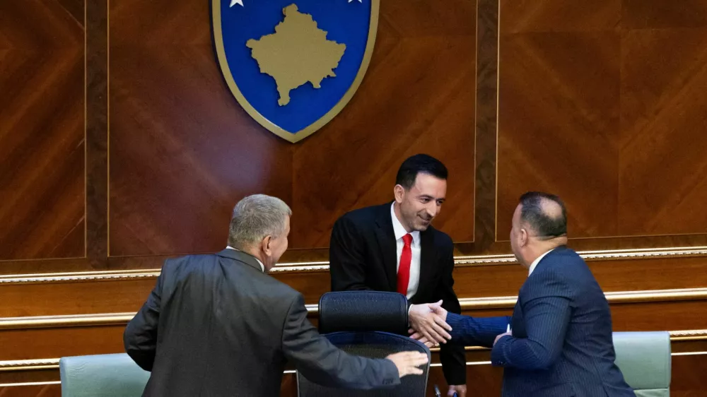 Attendees greet Dimal Basha, the newly elected speaker of Kosovo's parliament, following his election in Pristina, Kosovo August 26, 2025. REUTERS/Valdrin Xhemaj