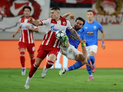 Soccer Football - UEFA Champions League - Play Off - Second Leg - Pafos v Red Star Belgrade - Alphamega Stadium, Kolossi, Cyprus - August 26, 2025 Pafos' David Goldar in action with Red Star Belgrade's Bruno Duarte REUTERS/Yiannis Kourtoglou