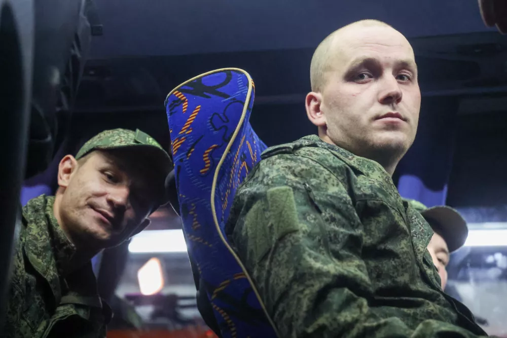 24 August 2025, Russia, ---: Russian Army servicemen released from Ukrainian captivity are seen on a bus in Russia. Photo: Sergei Fadeichev/TASS via ZUMA Press/dpa
