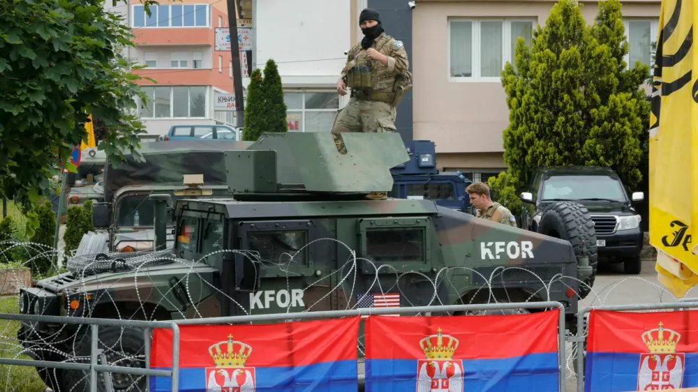 U.S. members of the NATO-led Kosovo Force (KFOR) stand guard outside municipal offices in Leposavic, Kosovo, June 2, 2023. REUTERS/Ognen Teofilovski