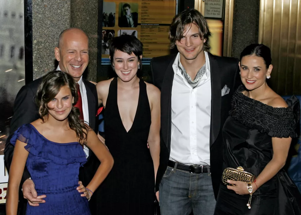 From left, Tallulah Willis, Bruce Willis, Rumer Willis, Ashton Kutcher and Demi Moore pose together as they arrive for the premiere of "Live Free Or Die Hard" at Radio City Music Hall Friday, June 22, 2007 in New York. (AP Photo/Jason DeCrow)