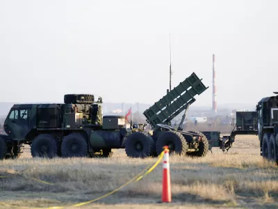 FILE - Patriot missiles are seen at the Rzeszow-Jasionka Airport, March 25, 2022, in Jasionka, Poland. The U.S. will send .8 billion in military aid to Ukraine in a massive package that will for the first time include a Patriot missile battery and precision guided bombs for their fighter jets, U.S. officials said Tuesday, Dec. 20, 2022, as the Biden administration prepares to welcome Ukrainian President Volodymyr Zelenskyy to Washington. (AP Photo/Evan Vucci, File)