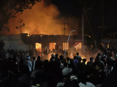 Flames engulf Grahadi Building, the official residence of East Java governor, in Surabaya, East Java, Indonesia, Saturday, Aug. 30, 2025, after it was set on fire during a protest sparked by reports of lawmakers receiving excessive housing allowances. (AP Photo/Trisnadi)