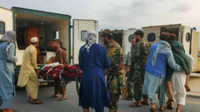 Taliban soldiers and civilians carry earthquake victims to an ambulance at an airport in Jalalabad, Afghanistan, September 1, 2025. REUTERS/Stringer