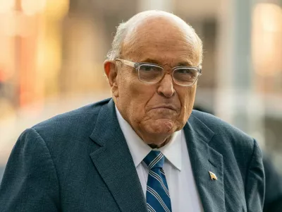 FILE PHOTO: Former New York City Mayor and former lawyer for U.S. President-elect Donald Trump, Rudy Giuliani walks outside United States District Court in Manhattan, where a judge will consider a request by two Georgia election workers to whom he owes 8 million for defamation to hold him in civil contempt for failing to turn over his assets, in New York City, U.S., January 3, 2025. REUTERS/David Dee Delgado/File Photo
