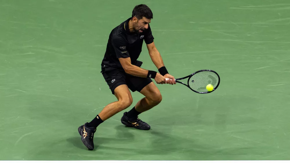 Aug 31, 2025; Flushing, NY, USA; Novak Djokovic of Serbia in action against Jan-Lennard Struff of Germany in the fourth round of the men's singles at the US Open at Arthur Ashe Stadium in Billie Jean King National Tennis Center. Mandatory Credit: Mike Frey-Imagn Images