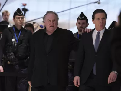 FILE - Actor Gerard Depardieu arrives with his lawyer Jeremie Assous, right, to face trial for the alleged sexual assaults of two women on a film set in 2021, Monday, March 24, 2025 in Paris. (AP Photo/Aurelien Morissard, file)