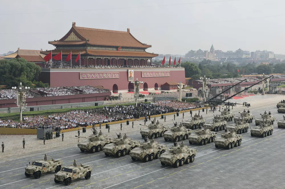 In this photo released by Xinhua News Agency, armament formations pass during the military parade to commemorate the 80th anniversary of the end of World War II held in front of Tiananmen Gate in Beijing, Wednesday, Sept. 3, 2025. (Guo Yu/Xinhua via AP)
