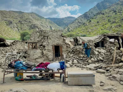An Afghan man looks for his belongings amidst the rubble of his collapsed house after a deadly magnitude 6 earthquake that struck Afghanistan on Sunday, at Lulam village, in Nurgal district, Kunar province, Afghanistan, September 3, 2025. REUTERS/Sayed Hassib