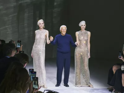 FILE -- Giorgio Armani with models at the end of his Priv&eacute; fashion show during Paris Fashion Week in Paris, June 25, 2024. Armani, a designer who rewrote the rules of fashion not once but twice in his lifetime, has died. His death was confirmed on Thursday, Sept. 4, 2025, in a statement by the Armani Group. He was 91.,Image: 1034258029, License: Rights-managed, Restrictions: A JUNE 25, 2024 FILE PHOTO., Model Release: no