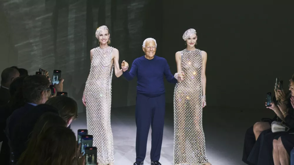 FILE -- Giorgio Armani with models at the end of his Priv&eacute; fashion show during Paris Fashion Week in Paris, June 25, 2024. Armani, a designer who rewrote the rules of fashion not once but twice in his lifetime, has died. His death was confirmed on Thursday, Sept. 4, 2025, in a statement by the Armani Group. He was 91.,Image: 1034258029, License: Rights-managed, Restrictions: A JUNE 25, 2024 FILE PHOTO., Model Release: no