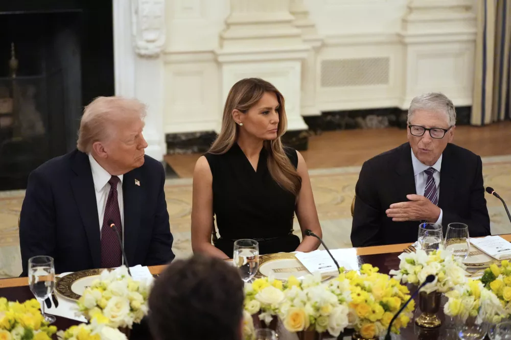Microsoft's Bill Gates speaks at a dinner with President Donald Trump and first lady Melania Trump in the State Dinning Room of the White House, Thursday, Sept. 4, 2025, in Washington. (AP Photo/Alex Brandon)