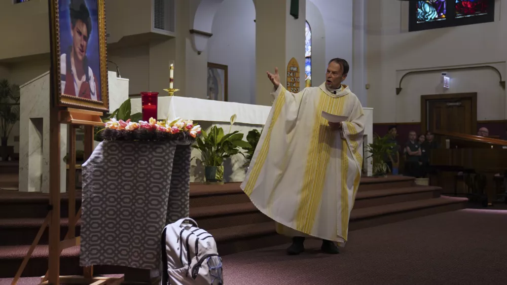 The Rev. Ed Howe, the pastor at Blessed Carlo Acutis Parish in Chicago's Northwest Side, leads a Mass themed for Acutis, who will be canonized a saint by Pope Leo XIV, at the parish church on Wednesday, Sept. 3, 2025, in Chicago. (AP Photo/Jessie Wardarski)