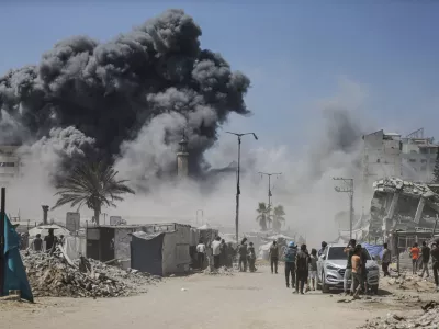 Smoke rises following an Israeli airstrike on a high-rise building in Gaza City, Friday, Sept. 5, 2025, after the Israeli army issued a prior warning. (AP Photo/Yousef Al Zanoun)