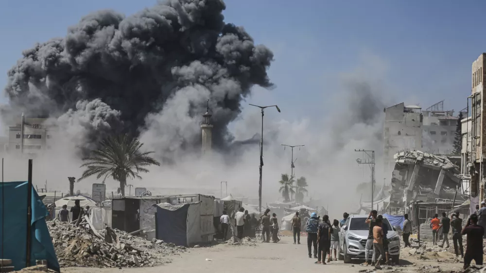 Smoke rises following an Israeli airstrike on a high-rise building in Gaza City, Friday, Sept. 5, 2025, after the Israeli army issued a prior warning. (AP Photo/Yousef Al Zanoun)