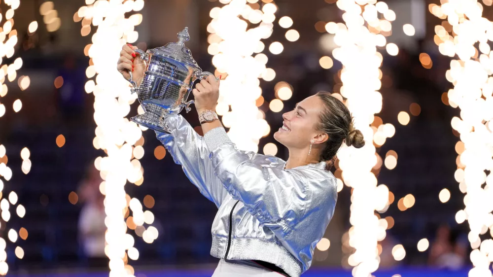 Sep 6, 2025; Flushing, NY, USA; Aryna Sabalenka celebrates with the championship trophy after defeating Amanda Anisimova (USA) (not pictured) the women's singles final of the 2025 US Open tennis championships at Billie Jean King National Tennis Center. Mandatory Credit: Robert Deutsch-Imagn Images